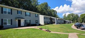 Newnan apartment for rent - a row of houses with cars parked in front of them