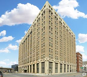 Chattanooga apartment for rent - A large, beige, rectangular building with many windows and a flat roof.