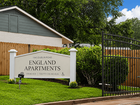 Alexandria apartment for rent - A sign for England Apartments is in front of a building.