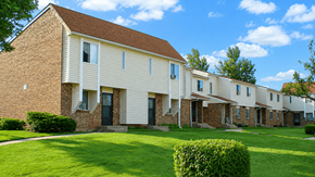 Kenton apartment for rent - A row of houses with green lawns in front.