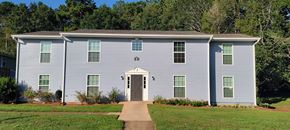 Thomaston apartment for rent - a white house with a sidewalk in front of it
