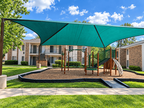 The Woodlands apartment for rent - A playground with a green canopy and a slide.