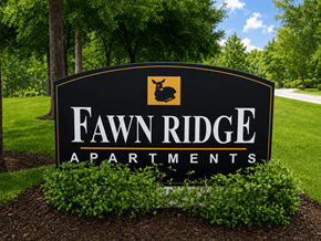 The Woodlands apartment for rent - A sign for Fawn Ridge Apartments is shown in front of a green lawn.