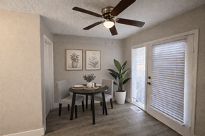 Kansas City apartment for rent - A dining room with a table, chairs, and a ceiling fan.