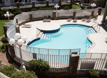 El Paso townhouse for rent - A round swimming pool surrounded by a white fence.