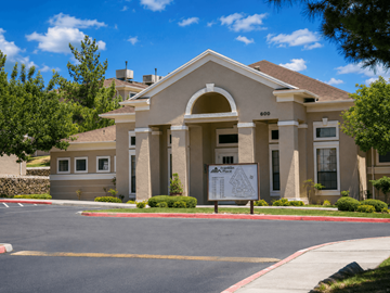 El Paso townhouse for rent - A building with a sign in front of it.