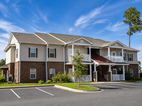 Nashville apartment for rent - A large two-story apartment building with a parking lot in front.