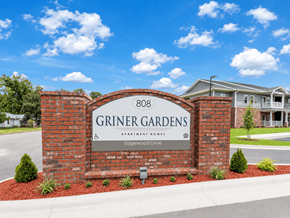 Nashville apartment for rent - A sign for Griner Gardens Apartment Homes stands in front of a house.