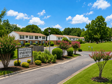 Dublin apartment for rent - Groveland Terrace Apartments is a residential complex with a well-maintained lawn and landscaping.