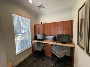 Clinton apartment for rent - an office with two computers on a desk