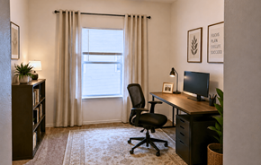 Kerrville apartment for rent - A room with a desk, chair, and a window with curtains.