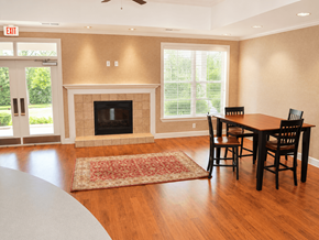 Montgomery apartment for rent - A living room with a fireplace and a dining table.