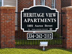 Montgomery apartment for rent - A sign for Heritage View Apartments is displayed in front of a brick wall.
