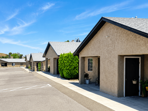 El Paso apartment for rent - A parking lot with a building in the background.