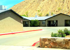 El Paso apartment for rent - a building with a mountain in the background and a parking lot