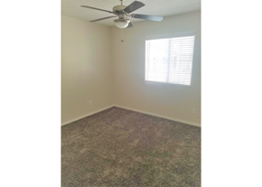El Paso apartment for rent - a bedroom with a ceiling fan and a window