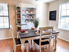 Arnold apartment for rent - a dining room with a table and chairs and a hutch