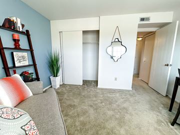 Arnold apartment for rent - a living room with a couch and a hallway with a closet