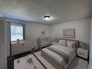 Hermitage apartment for rent - A bedroom with a large bed and a smaller bed in the corner.