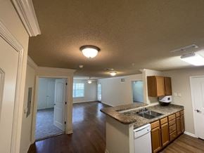 Cleveland apartment for rent - A kitchen with a sink, microwave, and cabinets.