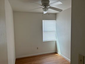 Abbeville apartment for rent - an empty room with a ceiling fan and a window