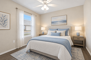 San Marcos apartment for rent - A bedroom with a large bed and a ceiling fan.