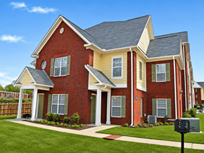 Memphis apartment for rent - A red brick house with a white roof and a mailbox in front.