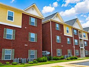 Memphis apartment for rent - A row of red brick apartment buildings with green shutters on the windows.