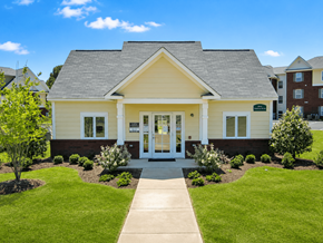 Memphis apartment for rent - A small yellow house with a grey roof and a white door.