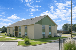 Abbeville apartment for rent - A large building with a green roof and beige walls.