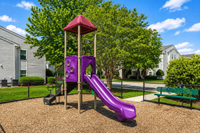 Hampton apartment for rent - A purple slide in a playground with a red roof.