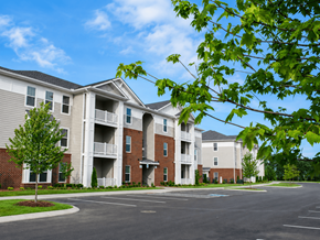 Lebanon apartment for rent - Apartment complex with a parking lot in front.