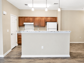Lebanon apartment for rent - A kitchen with a white counter and brown cabinets.