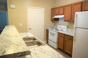 Lebanon apartment for rent - a kitchen with white appliances and granite counter tops