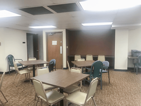 Alton apartment for rent - a conference room with tables and chairs and a door