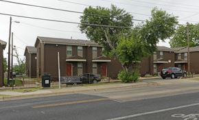 Austin townhouse for rent - Apartment complex with a car parked in front.