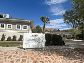 El Paso townhouse for rent - a sign in front of a house with a palm tree