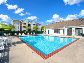 Chesapeake apartment for rent - A large swimming pool with a red border and white lounge chairs.