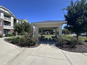 Elizabeth City apartment for rent - a pavilion with a seating area in front of an apartment building
