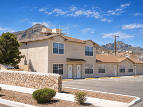 El Paso apartment for rent - A building with a stone wall in front of it.