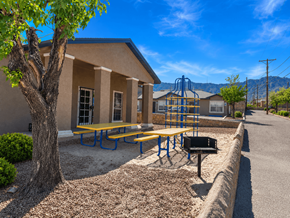 El Paso apartment for rent - A small building with a playground in front of it.