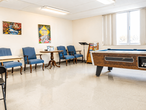 Nashville apartment for rent - A room with a pool table and chairs.