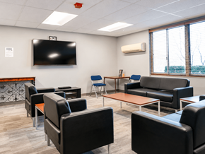 Nashville apartment for rent - A conference room with a television on the wall and comfortable seating.