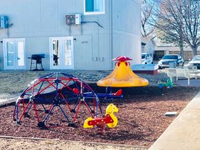 Lamar apartment for rent - a playground in a yard with a swing set and other toys