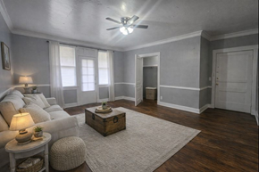 Memphis apartment for rent - A living room with a white couch, a wooden coffee table, and a rug.