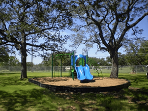 Bandera apartment for rent - a playground with a blue slide in a park