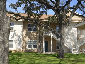 Bandera apartment for rent - an apartment building with stairs and trees in front of it