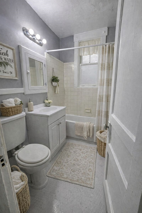 Memphis apartment for rent - A bathroom with a toilet, sink, and shower.