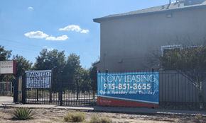 Clint apartment for rent - a now leasing sign is posted on the gate of a building