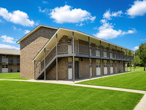 Mcalester apartment for rent - A building with a staircase leading to the second floor.